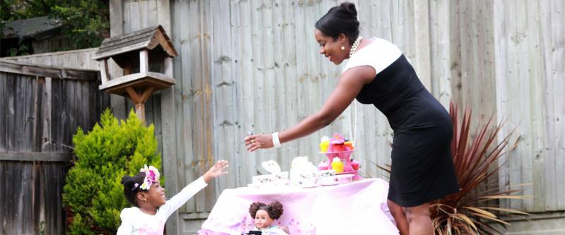little girl and mother playing