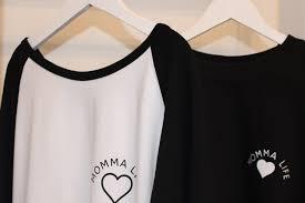 Sweat tops on a hanger with Momma Life heart logo