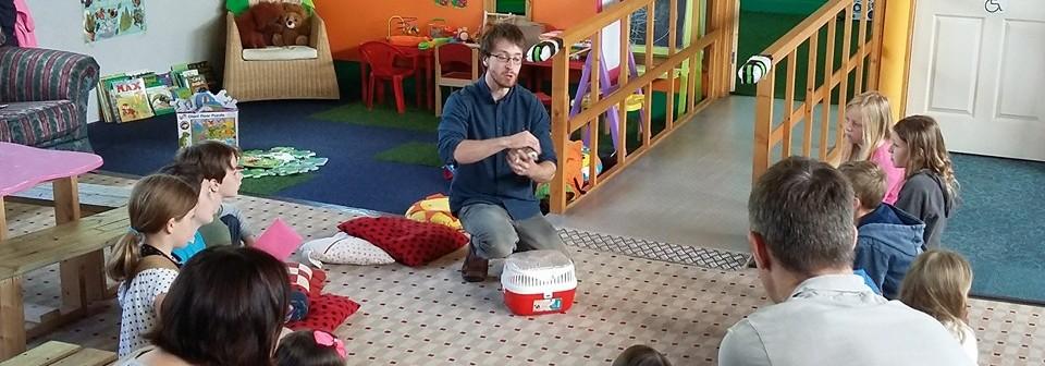 children meeting an animal at plant and play wildlife centre