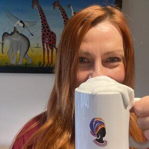 Victoria Orr founder of Amandla Ubuntu holding a mug